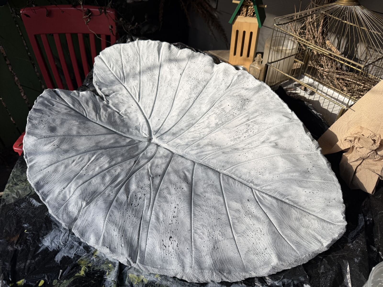 Cured concrete leaf cast, gray with a light wash, before green paint