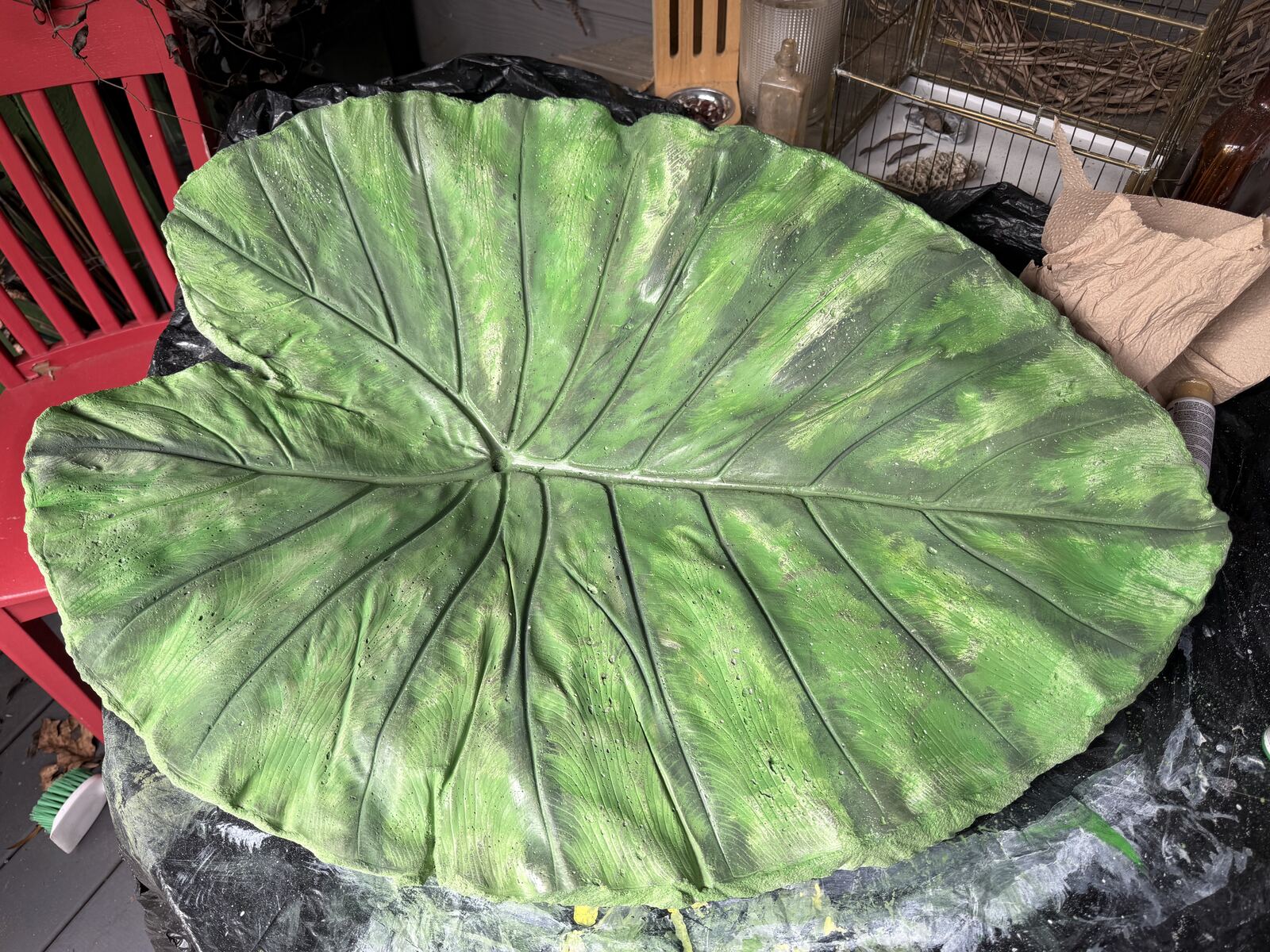 Leaf cast building up to a mottled mid-green