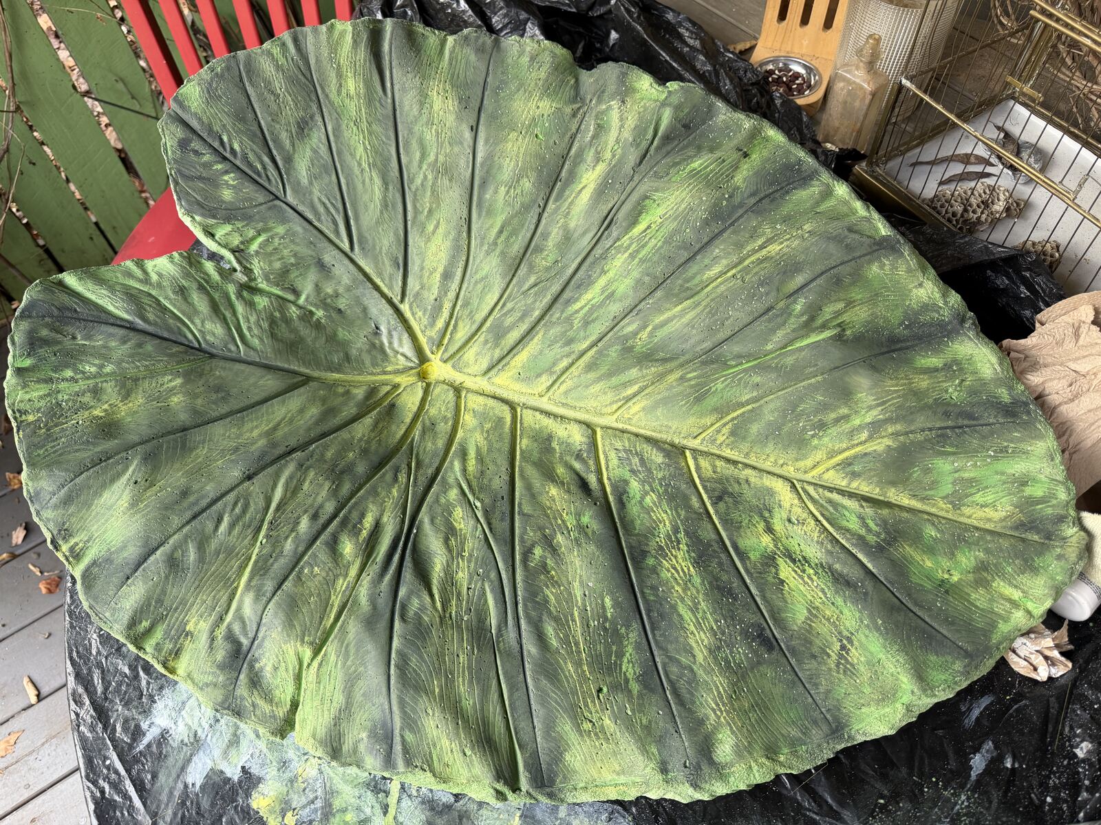 Finished painted leaf cast, richly mottled green with a glowing yellow center